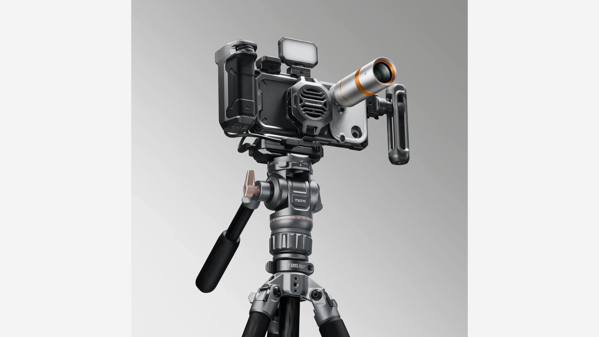 OPPO Find X10 Pro Max in a Tilta cage rig with handles, cooling fan, and Teleconverter on a tripod