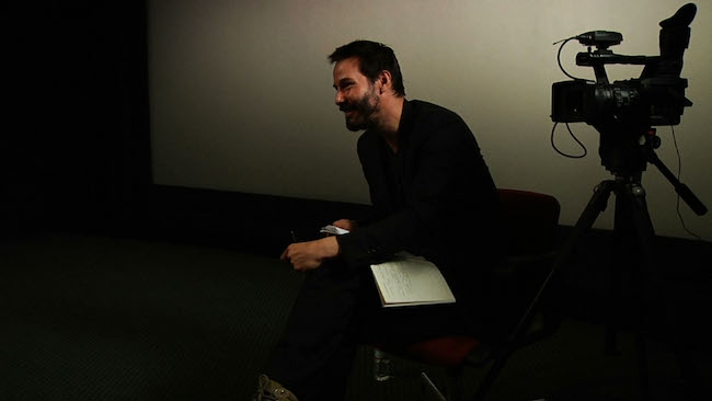 Keanu Reeves, producer and host of Side by Side, interviews a subject for the documentary exploring the evolution of film and digital. (Credit: Courtesy of ©2012Company Films LLC, all rights reserved