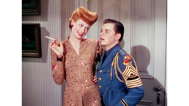 Best Foot Forward, of 1943. A redhead, a blue jacket, and a carefully-controlled pattern of hard light. Notice the multiple shadows on the door behind them. MGM