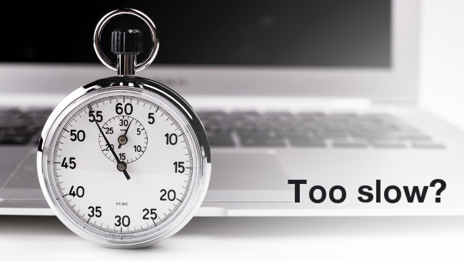 Silver stopwatch with silver laptop in the background graphic via Shutterstock David Orcea / RedShark News