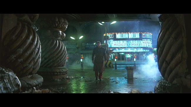 Blade Runner. The pillars were added; otherwise, it's just an LA street with light, water, steam, and a few comparatively minor props (which were reused a lot) Warner Bros. / Columbia