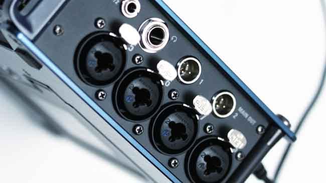 The right face holds inputs 5-8, the main and sub outputs, and the headphone jack. The jacks are bolted through the side of the metal case.