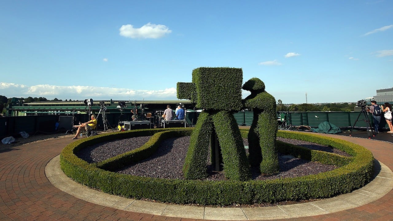 On location at SW19: We suspect this is the world's only topiary cameraman... AELTC