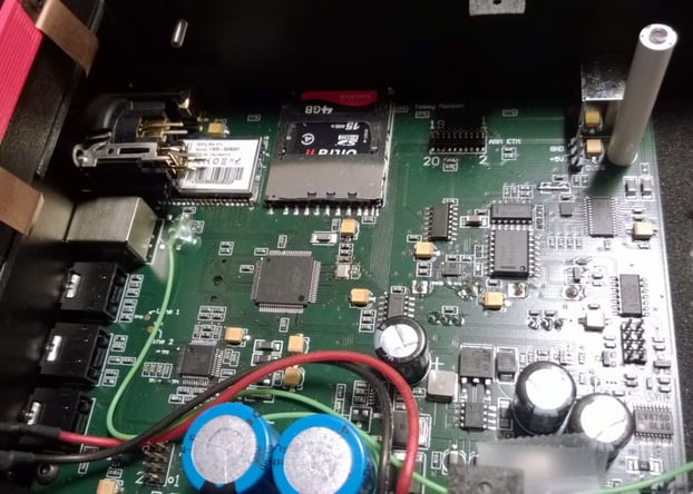 One of the main board's many revisions: a WiFi chip, SD card reader, Scilab ARM mikro controller, JTAG port, DDS and PLL motor controllers, On-Screen-Display chip and Sanyo motor driver which unleashes a power of 24W without cooling.