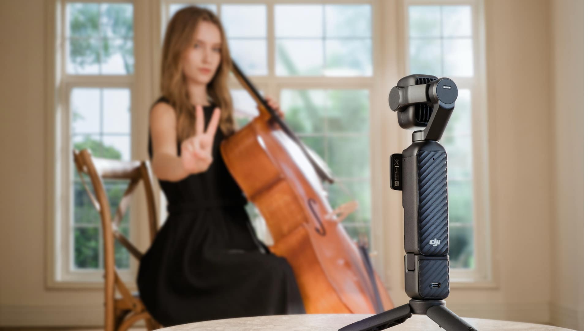 DJI Osmo Pocket 4P recording a cellist making a V-sign gesture to start recording