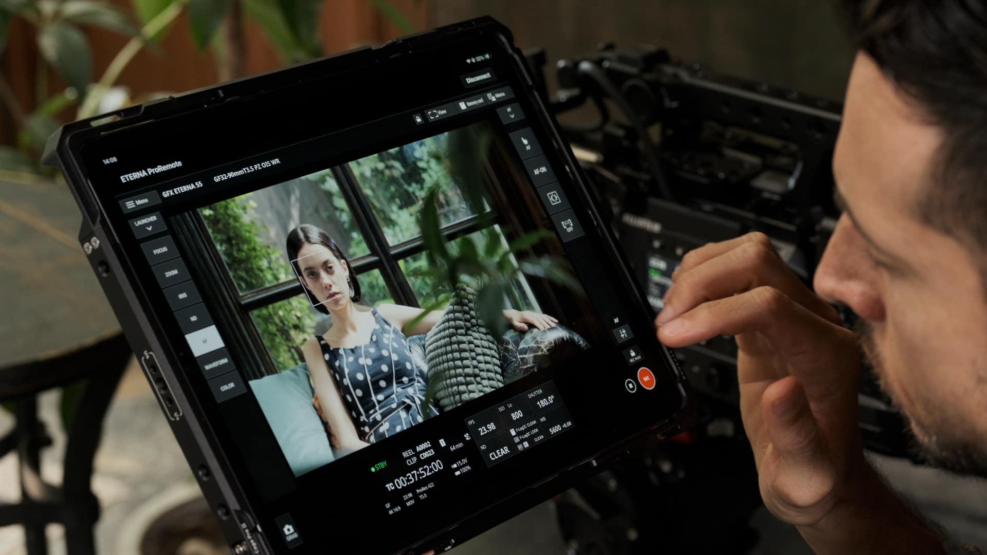 ETERNA ProRemote app on tablet showing touch-AF face tracking on GFX ETERNA 55 live feed