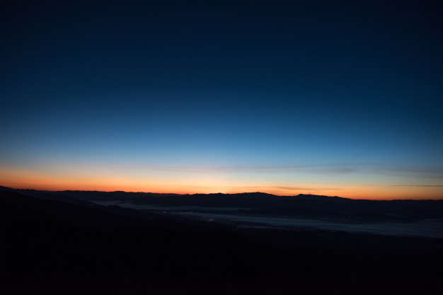 The blue hour, before sunrise or sunset.