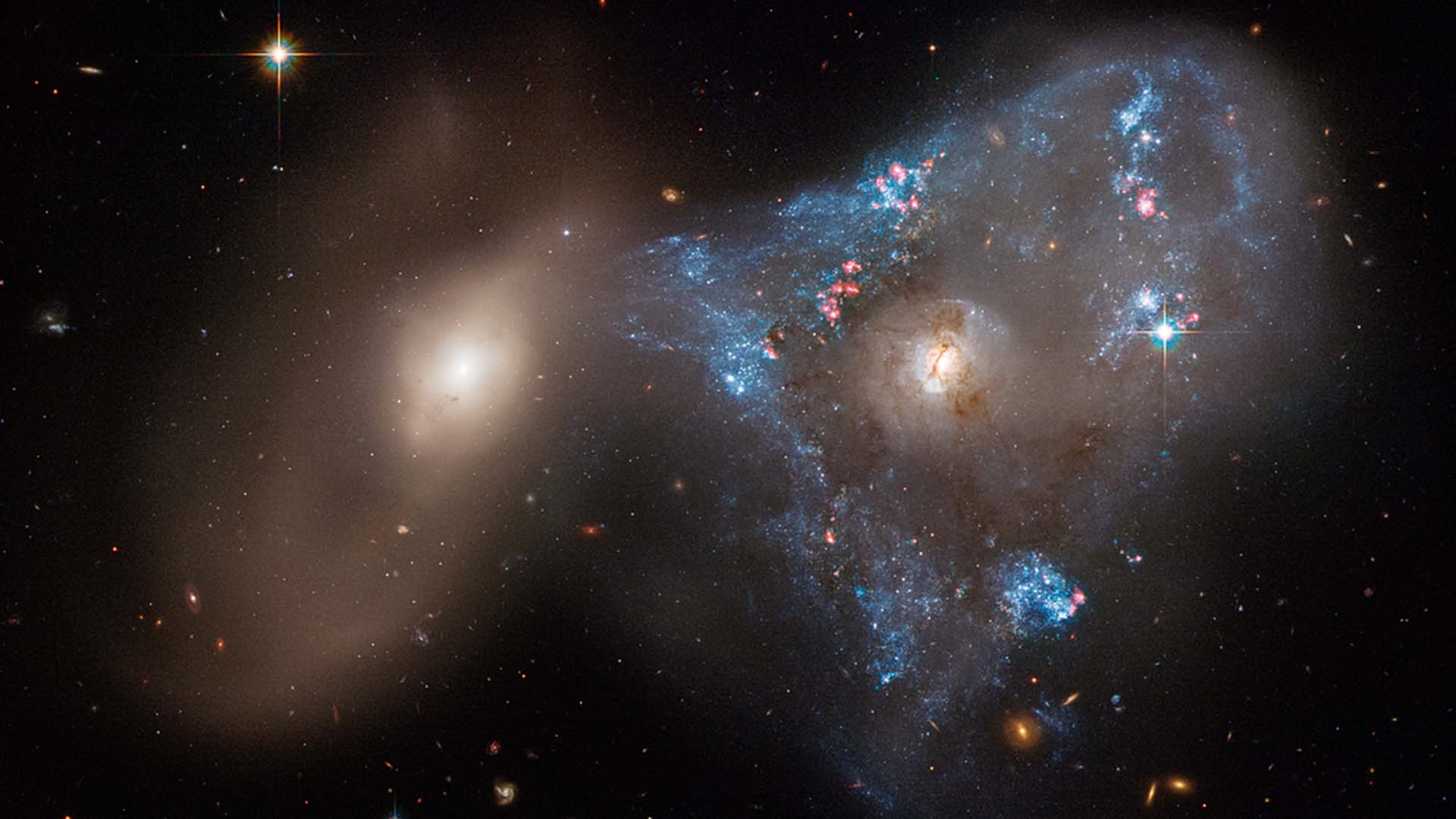 Hubble captures a collision between two galaxies. Image: NASA.