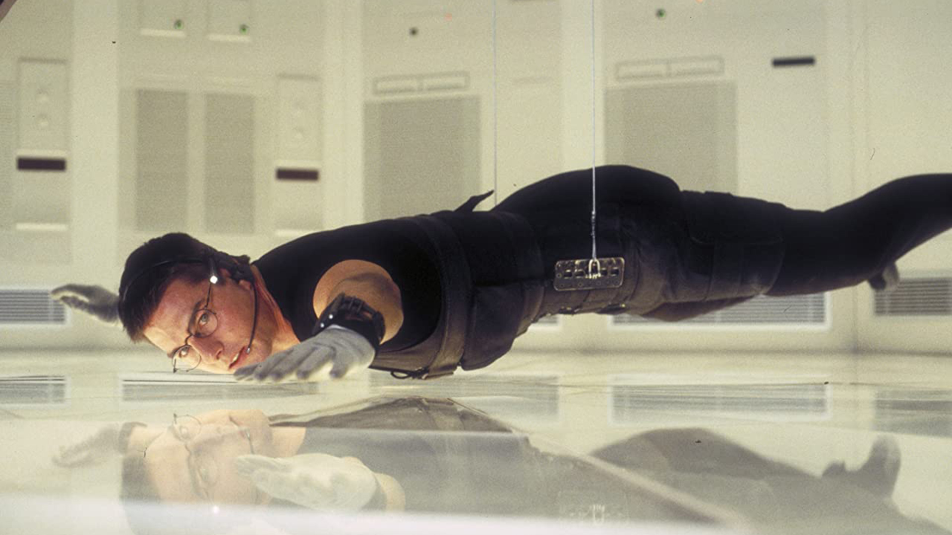 Tom Cruise as Ethan Hunt in an iconic scene from Mission: Impossible. Image: IMDB.