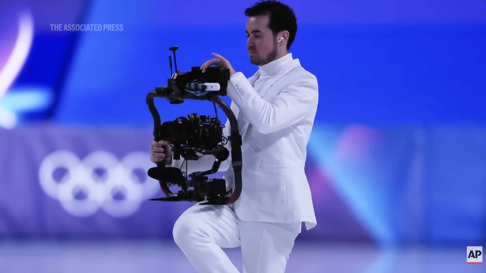 Jordan Cowan filming on ice at Milano Cortina 2026. Pic: AP